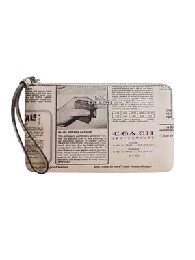 COACH LARGE CORNER ZIP WRISTLET WITH NEWSPAPER PRINT